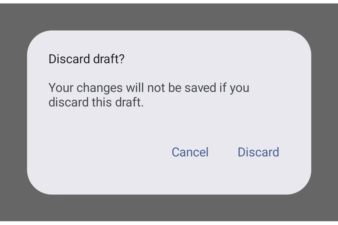 Material 3 alert dialog with title, supporting text, and Cancel/Discard buttons