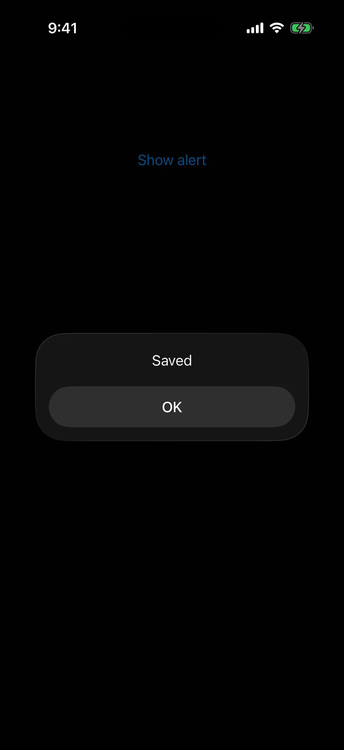 Alert titled Saved with a single OK button, above the Show alert trigger